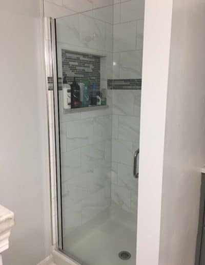 glass shower door tile shelf